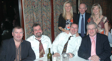 Alan Hunter, Andrew Best, Neil Hunter, Ross McCollum. Standing: Julie Hunter, Nick Boardman, Janet McCollum.